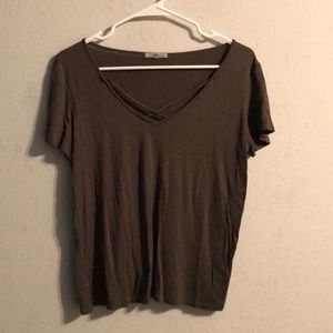 Cute dark green shirt with criss cross